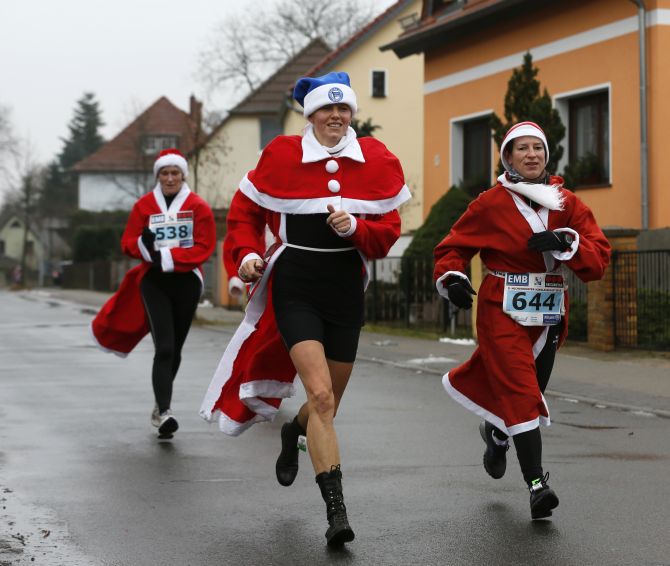 Competitors run in the Nikolaus Run (Santa Claus Run) in the east German town of Michendorf, some 40 km southwest of Berlin. 