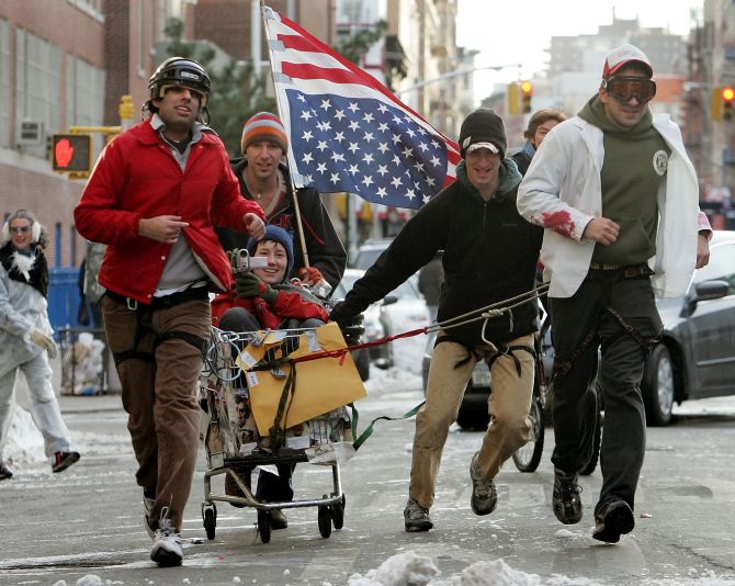 Competitors run during the annual 'Idiotarod'.