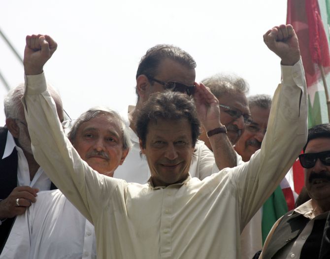 Imran Khan, chairman of Pakistan Tehreek-e-Insaf political party, gestures as he leads the Freedom March in Lahore 