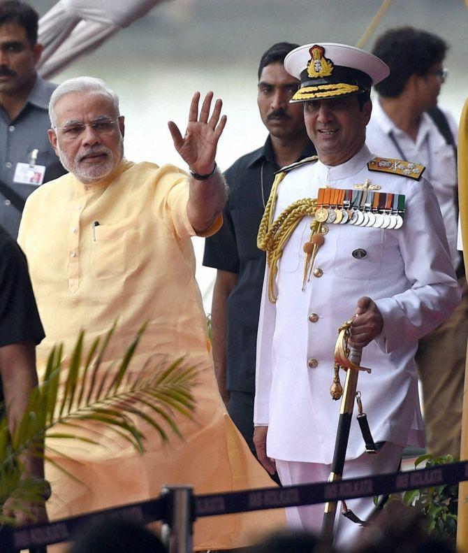 PM Narendra Modi along with Admiral RK Dhowan, Chief of Naval Staff, during the commissioning ceremony of INS Kolkata. 