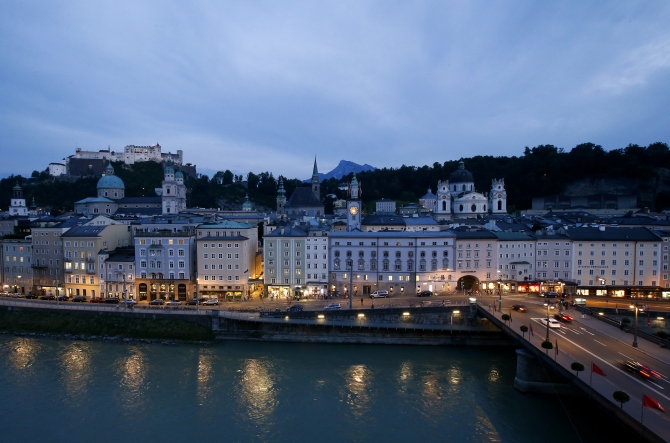 A general view shows the city of Salzburg next to river Salzach during a summer evening.