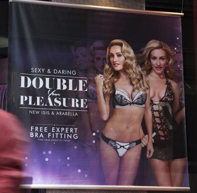 an advertisement displayed in the window of an Ann Summers store in London.