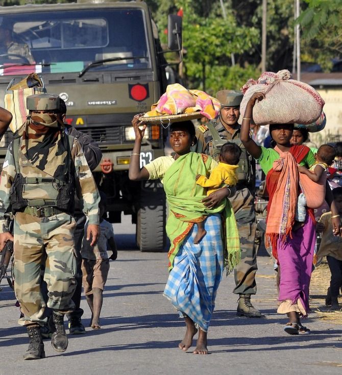 Adivasis flee their villages after the Bodo massacre in Assam. Photograph: PTI Photo