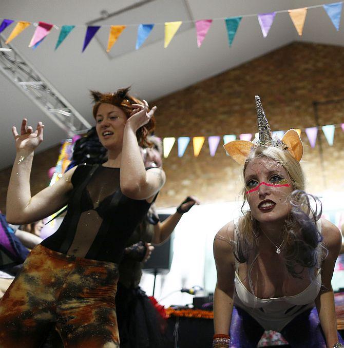 Revellers dance at Morning Glory, in a venue in Hackney, London. Morning Glory is a nightclub which operates once a month from 6:30 to 10:30 am, at which revellers drink fruit smoothies, coffee and dance to high energy music, sometimes in their sleepwear