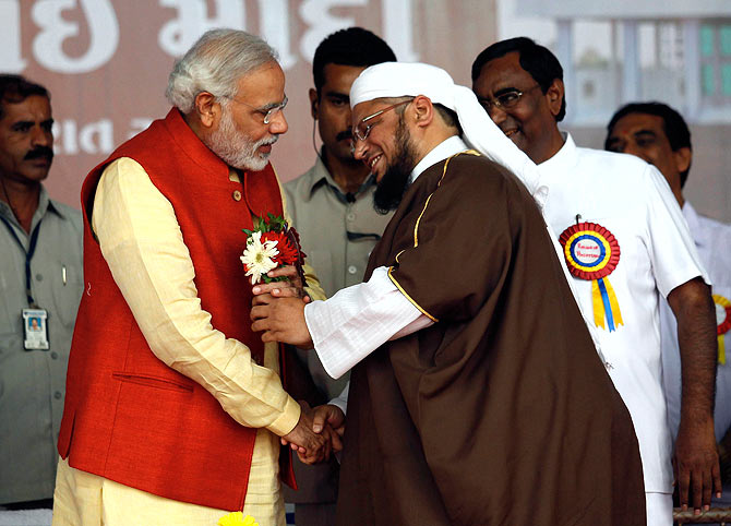 Gujarat Chief Minister Narendra Modi , with a Muslim cleric after the inauguration of a hospital owned by a Muslim trust at Balasinore town, near Ahmedabad, November 10, 2013.