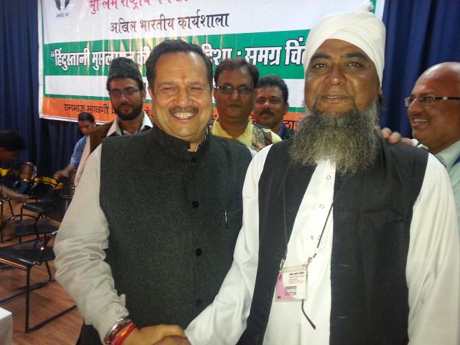 Indresh Kumar with a Muslim delegate from Madhya Pradesh at the Muslim Rashtriya Front conclave on December 14, 2013.