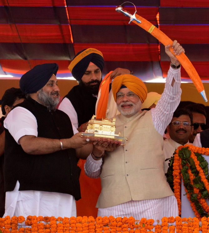 Modi waves a sword at a rally in Ludhiana, Punjab 