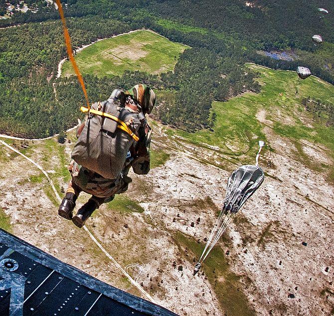 An Indian paratrooper exits a CH-47 Chinook helicopter during the 2013 Yudh Abhyas bilateral training exercise at Fort Bragg, USA.