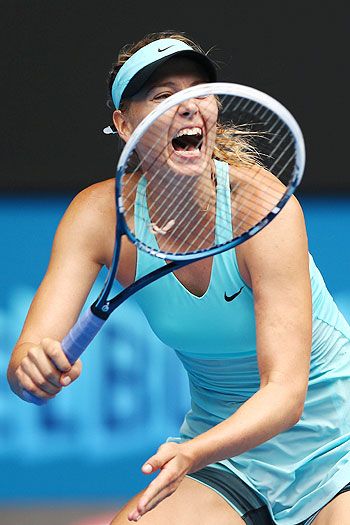 Maria Sharapova of Russia plays a forehand in her third round match against Alize Cornet of France at the Australian Open on Saturday