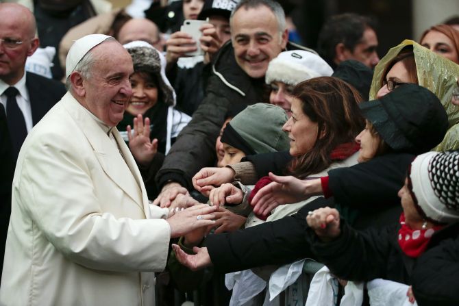 Pope Francis greets the faithful at the Sacro Cuore Basilica in Rome on Sunday, January 19.