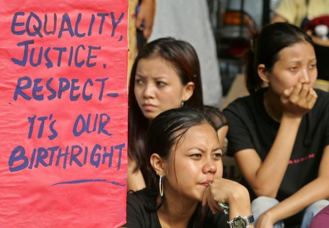 Students from North East Students Joint Action Committee hold a placard during a protest in New Delhi