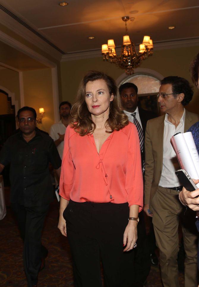 Valerie Trierweiler, former companion of French President Francois Hollande, and actress Charlotte Valandrey (right) get out of a children's ward in at Sion Hospital, Mumbai