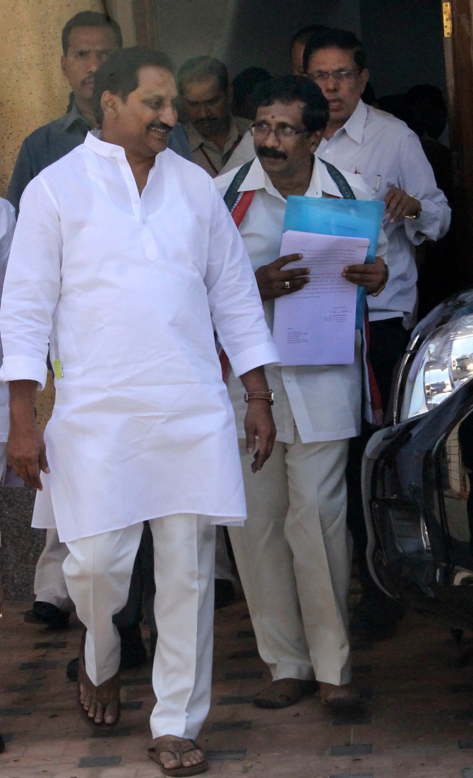 Andhra CM Kiran Kumar Reddy walks out of the assembly after the debate on Telangana
