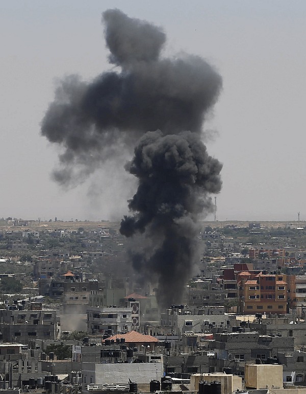 Smoke rises following what witnesses said was an Israeli air strike in Rafah in the southern Gaza Strip July 11