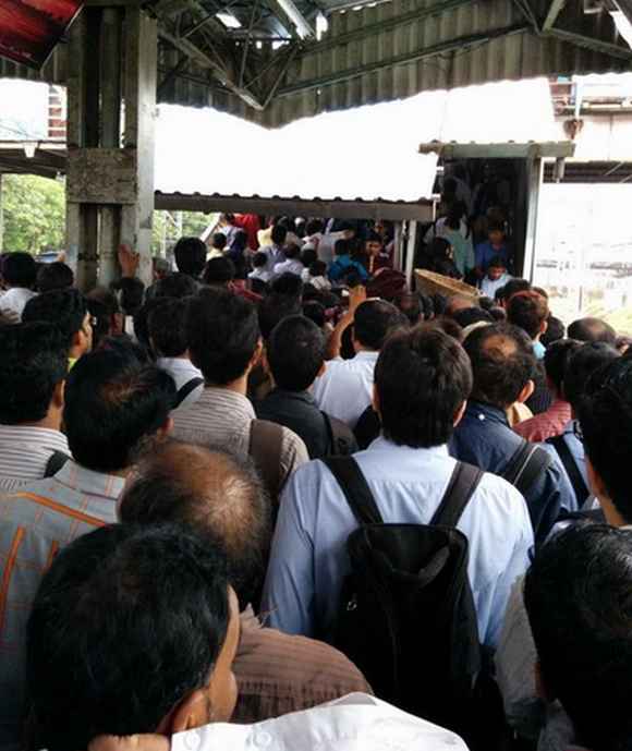 Railway stations witnessed heavy rush during peak hours as suburban trains were running late