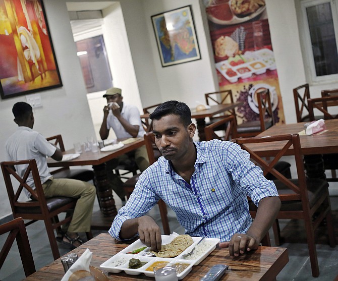 Customers eat inside a restaurant run by the Tihar Jail authorities on Jail Road in west Delhi