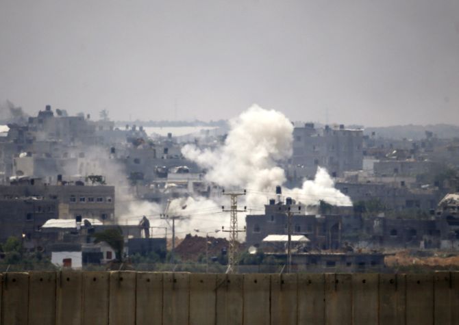 Smoke is seen after an Israeli strike over the Gaza Strip July 22, 2014. Israel pounded targets across the Gaza Strip.
