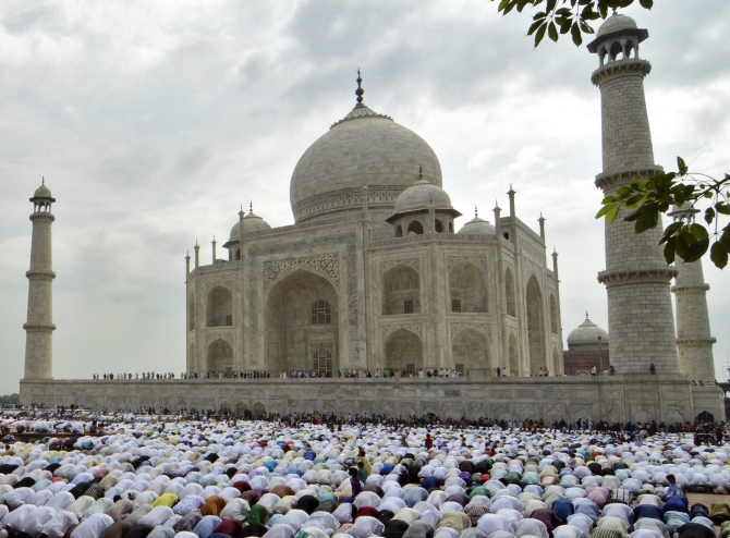 Muslims offer prayers on the occasion of Eid al-Fitr at the historic Taj Mahal in Agra.