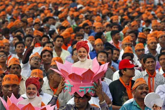 A supporter of Narendra Modi gestures during a campaign rally in Uttar Pradesh