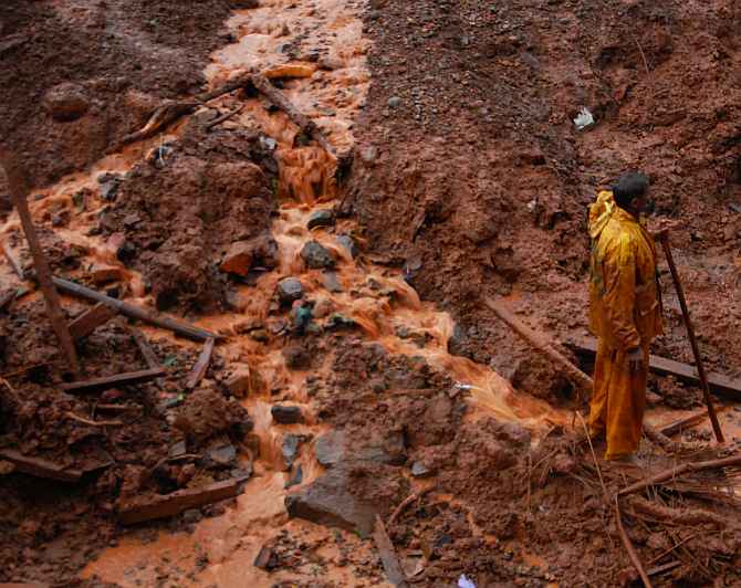 A rescue worker at site of the landslide near Pune on Wednesday