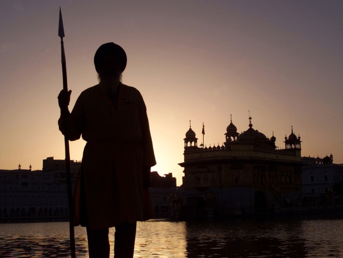 A Sikh temple worker stands guard inside the Golden Temple complex in Amritsar, in Punjab, in this photograph taken on March 5, 2003.