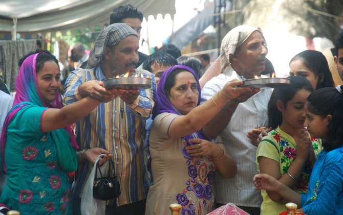 Devotees offer prayers to the deity during the mela