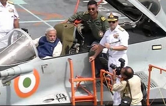 Prime Minister Narendra Modi in a MiG 29K jet on board the INS Vikramaditya.