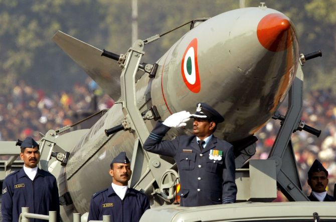 Indian soldiers stand beside India's surface-to-surface missile, Prithvi