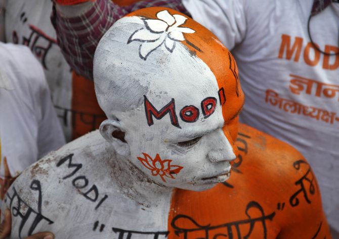 A BJP supporter attends a rally in Lucknow.