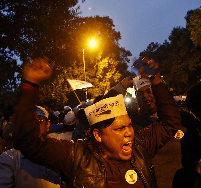 AAP supporters shout slogans during the protest outside the BJP headquarters