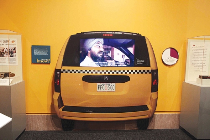A display depicting an Indian cabbie in New York.