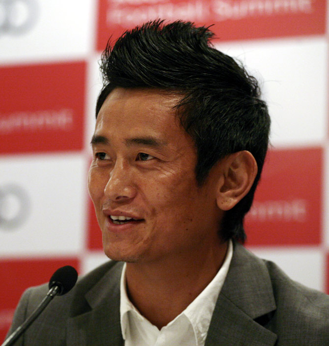 Former India soccer team captain Baichung Bhutia speaks during a news conference in New Delhi