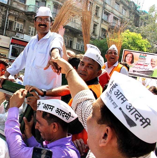 AAP leader Arvind Kejriwal greets a supporter in Mumbai on Wednesday, March 12.