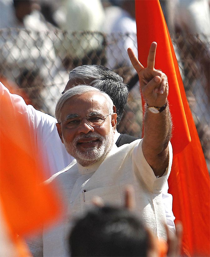 Narendra Modi gestures during a rally in Gujarat