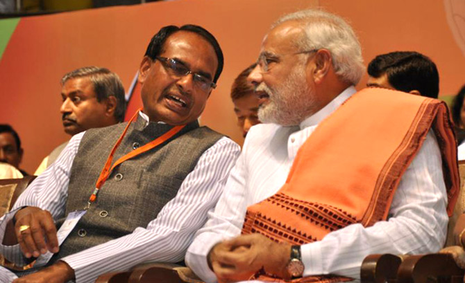 Narendra Modi, the BJP's prime ministerial candidate, with Madhya Pradesh Chief Minister Shivraj Singh Chouhan, who has brought about the spectacular turnaround of a sinking, ramshackle state into the agricultural powerhouse.