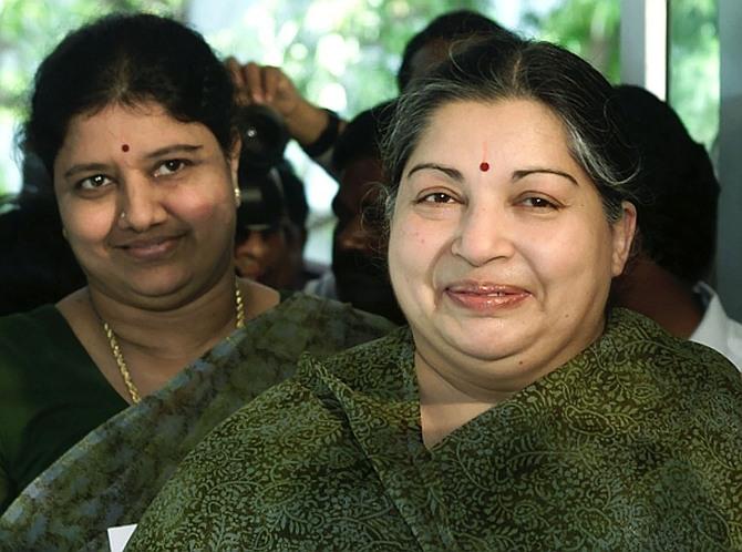 Jayalalitha with Sasikala Natarajan and an unidentified woman at a polling booth in Chennai in this May 10, 2001 picture