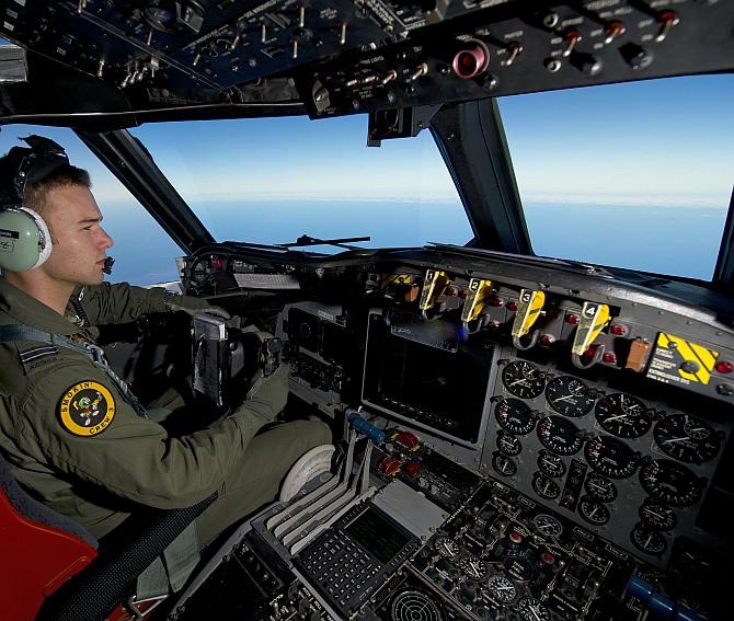 Royal Australian Air Force pilot, Flight Lieutenant Russell Adams from 10 Squadron, steers his AP-3C Orion over the Southern Indian Ocean during the search for missing Malaysian Airlines flight MH370