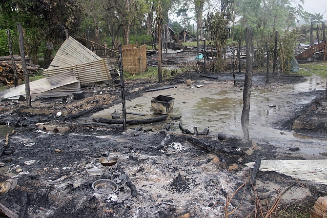 A view of the houses that were burnt during the attacks is pictured at Baksa district