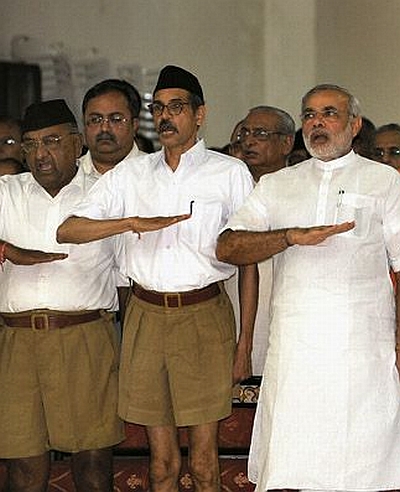 Narendra Modi, right, with RSS activists. Indresh Kumar says, 'This movement started in 2002 and Modi is in the line of prime ministership only for the last couple of years.'