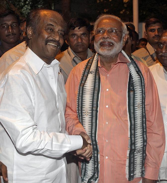 BJP's PM candidate Narendra Modi and film star Rajinikanth share a light moment in Chennai.