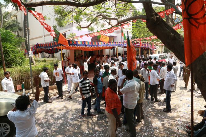 BJP supporters gather outside Kamalalayam, the party headquarters in Chennai, to celebrate the victory.