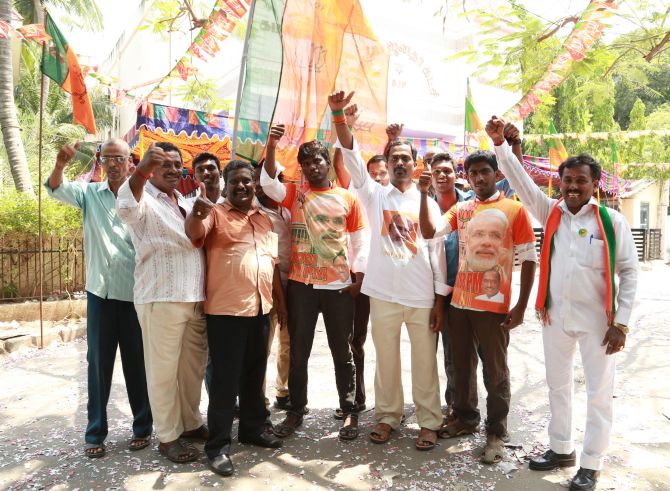 Modi supporters in NaMo T-shirts outside the BJP party office.