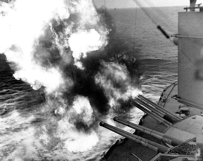 Forward 14'/45 guns of USS Nevada (BB-36) fire on positions ashore, during the landings on 'Utah' Beach
