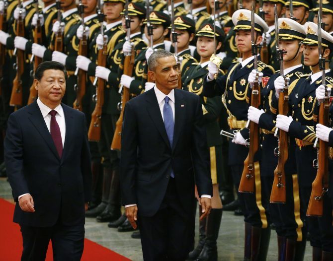 Chinese President Xi Jinping with Barack Obama as the American president inspects an honour guard at the Great Hall of the People in Beijing, November 12, 2014. Photograph: Petar Kujundzic/Reuters