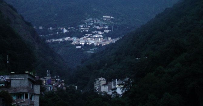 A view of the brightly-lit Chinese side from the power-starved Nepal border