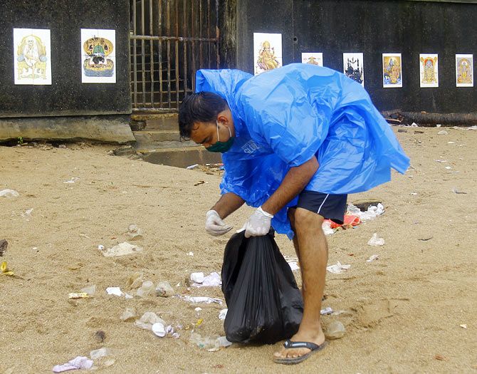 A volunteer cleaning up Mumbai's beach.