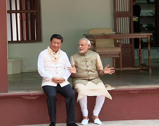 Prime Minister Narendra Modi and Chinese President Xi Jinping at Mahatma Gandhi's ashram in Ahmedabad. Photograph: PTI Photo