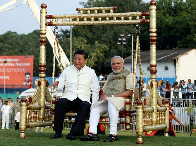 Prime Minister Narendra Modi and Chinese President Xi Jinping on a jhoola at the Sabarmati waterfront, September 17, 2014. Photograph: Press Information Bureau