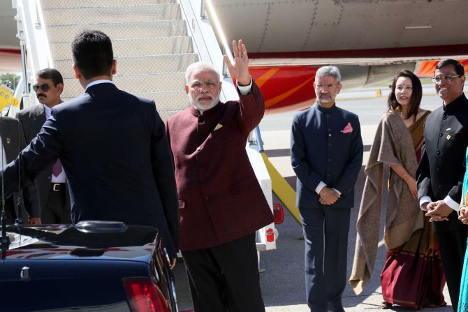 Foreign Secretary Dr S Jaishankar, then India's ambassador to the United States, near the stairs of the aircraft with his wife Kyoko Jaishankar and India's then consul general in New York Ambassador Dynaneshwar Mulay during Prime Minister Narendra Modi's visit to the US in September 2014. Photograph: Mohammad Jaffer/SNAPSIndia