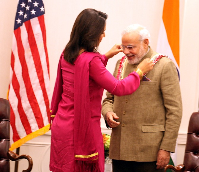 Tulsi Gabbard with Narendra Modi when the Indian prime minister visited the US in September 2014. Photograph: Mohammed Jaffer/SnapsIndia